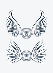 Set of two outlined heraldic designs with wings and crown