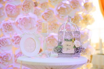 wedding decor birdcage at restaurant with all beauty and flowers