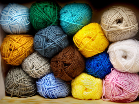 multi-colored tangles of yarn and thread for knitting