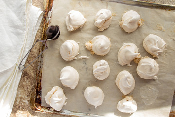 Meringues on cooking sheet top view