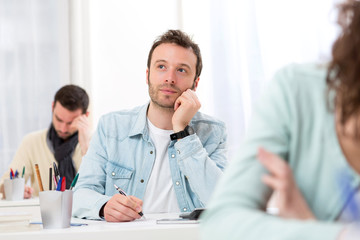 Obraz premium Young attractive man taking exams