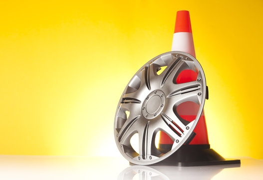 car alloy wheel with traffic cone