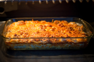casserole with cheese in oven
