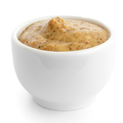 Small white ceramic dish of Czech mustard. Isolated.