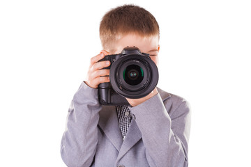 kid holding a dslr camera isolated on the white