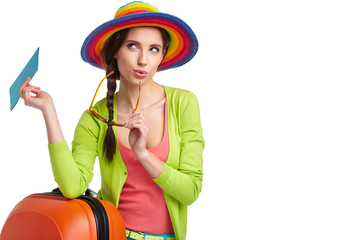 Portrait of female tourist with travel suitcase and blue boardin