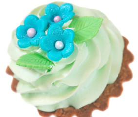 Cake basket decorated with light green cream and blue flowers fr