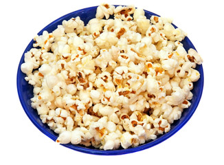 Popcorn in a blue plate isolated closeup