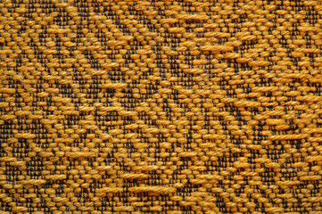 Woolen upholstery with orange color with a pattern of black thre