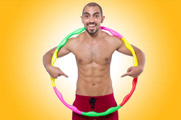 Man doing excecises with hula hoop
