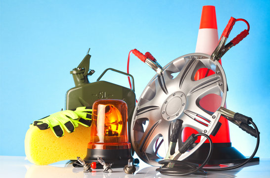 car accessories and road emergency items on blue background
