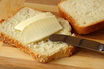 Sandwich with butter and knife.