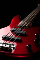 Fototapeta na wymiar Bass guitar close-up. Photo in low key