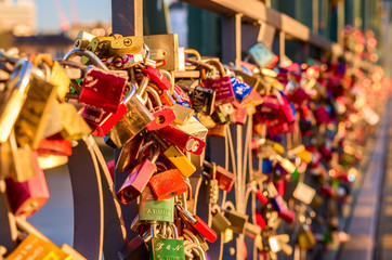 Horizontally oriented, love locks on the bridge