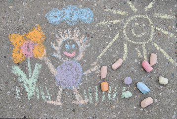 sidewalk spring chalk painting with sun, flower and doll