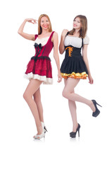 Girls in bavarian costumes isolated on white