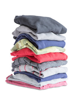 Folded Clean Clothes in a Pile on White Background