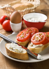 breakfast - bread with tomatoes and cream cheese