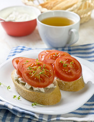 breakfast - bread with tomatoes and cream cheese