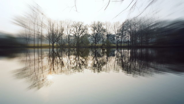Lake at ostpark at sunny morning in frankfurt, germany. trees re