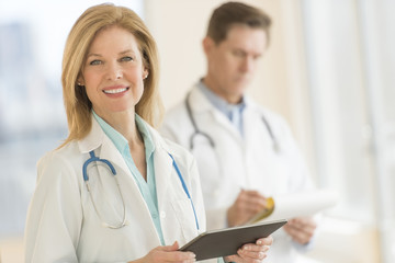 Fototapeta premium Female Doctor Using Digital Tablet At Hospital