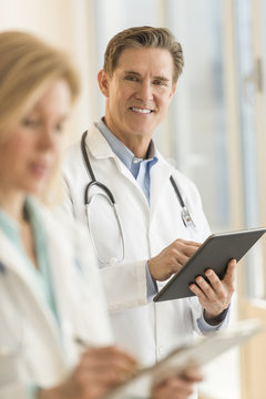 Male Doctor Using Digital Tablet At Hospital