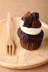 chocolate cake on wooden plate