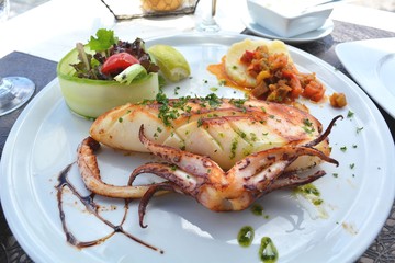 The grilled squid dish is of the Mediterranean cuisine