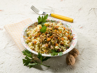 couscous with bacon carrot dried grape and nuts