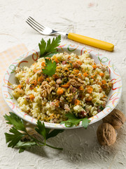 couscous with bacon carrot dried grape and nuts