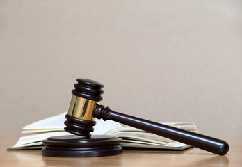 wooden gavel and books
