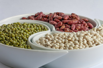 Multicolored beans in ceramics bowl