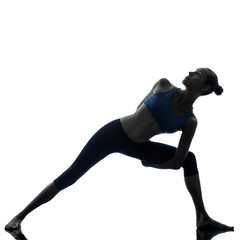 Fototapeta na wymiar woman exercising stretching triangle pose yoga silhouette