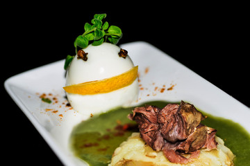 Decorated egg, spinach, lean beef and potatoes