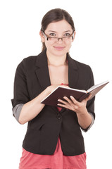 Fototapeta premium portrait of pretty female teacher wearing glasses and holding