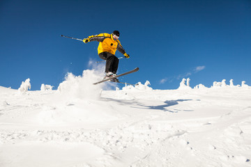 Man Snow Skiing Against Blue Sky
