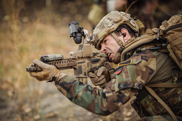 Fototapeta premium soldier aim at a target of weapons