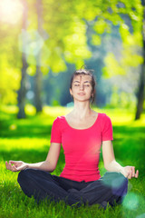 Young woman doing yoga exercises