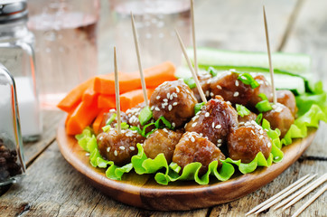 meatballs with Teriyaki sauce and sesame seeds
