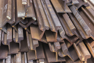 Stack of steel and rusty rail profiles