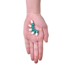 Isolated hand with pills