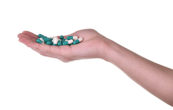 Isolated hand with pills