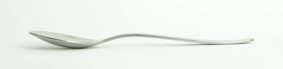 Metal and wood spoon in profile