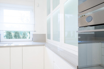 Interior of bright, white kitchen