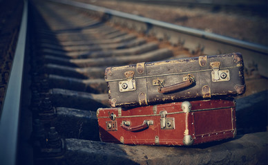 Old suitcases on rails
