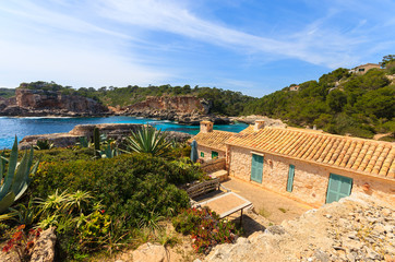 Stone houses in Cala S'Almunia bay, Majorca island, Spain