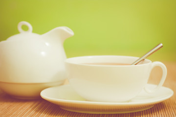 white cup of tea