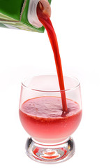 pouring a glass of tomato juice