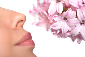 Close-up nose and a flower. Allergy to pollen of flowers. asthma