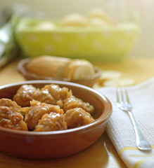 Homemade meatballs served in a clay bowl